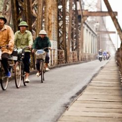Cycling along Long Bien Bridge Hanoi tour packages