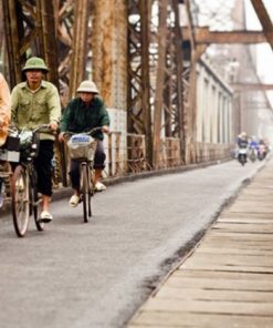 Cycling along Long Bien Bridge Hanoi tour packages